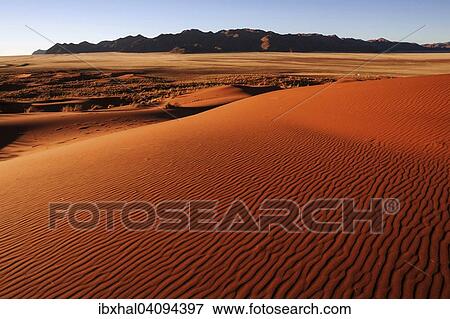 Southern foothills of the Namib desert, sand dunes, structures, behind the Tiras Mountains, evening light, Namibia, Africa View Large Photo Image Stock Photo - Southern foothills of the Namib desert, sand dunes, structures, behind the Tiras Mountains, evening light, Namibia, Africa. Fotosearch