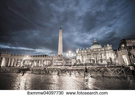 Stock Image - St. Peter's Square with St. Peter's Basilica and obelisk, clouds, dusk, Vatican City, Rome, Italy, Europe. Fotosearch