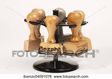 Stamp with the word Bezahlt, German for paid with stamp holder View Large Photo Image Stock Photo - Stamp with the word Bezahlt, German for paid with stamp holder. Fotosearch