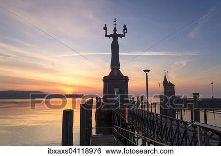 Stock Photograph - Statue of Imperia at the entrance of the harbour of Konstanz at sunrise, historic centre, Konstanz, Baden-Wurttemberg, Germany, Europe. Fotosearch