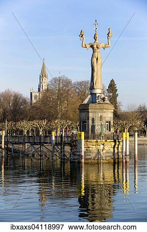 Stock Photo - Statue of Imperia at the harbour of Konstanz with Konstanz Cathedral behind, historic centre, Konstanz, Baden-Wurttemberg, Germany, Europe. Fotosearch