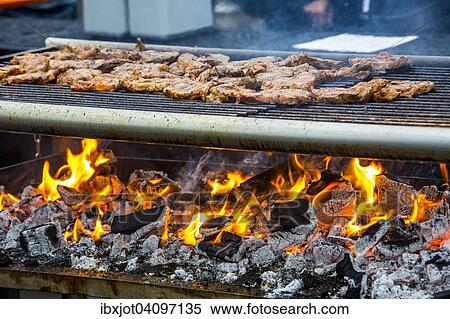 Steaks on a charcoal grill with flames View Large Photo Image Stock Photography - Steaks on a charcoal grill with flames. Fotosearch