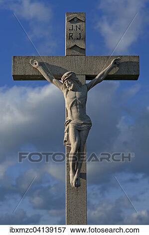 Stone crucifix against blue cloudy sky, Bavaria, Germany, Europe View Large Photo Image Stock Photo - Stone crucifix against blue cloudy sky, Bavaria, Germany, Europe. Fotosearch
