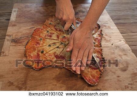 Stonebaked pizza being cut on a board View Large Photo Image Stock Image - Stonebaked pizza being cut on a board. Fotosearch