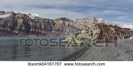 Stony beach and unfolded coloured rock strata, former marine sediments, Berzelius Bjerg, Segelsallskapet or Segelselskapets Fjord, Northeast Greenland National Park, Greenland, North America View Large Photo Image Stock Photo - Stony beach and unfolded coloured rock strata, former marine sediments, Berzelius Bjerg, Segelsallskapet or Segelselskapets Fjord, Northeast Greenland National Park, Greenland, North America. Fotosearch