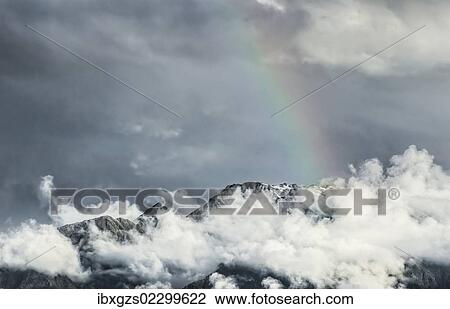Storm clouds with a rainbow, Southern Alps, Fox Glacier, South Island, New Zealand, Oceania View Large Photo Image Stock Image - Storm clouds with a rainbow, Southern Alps, Fox Glacier, South Island, New Zealand, Oceania. Fotosearch
