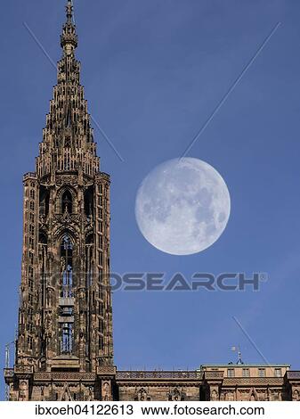 Stock Image - Strasbourg Cathedral, tower with full moon, Strasbourg, France, Europe. Fotosearch