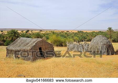 Straw huts in the oasis of Azougui, near Atar, Adrar Region, Mauritania, Africa View Large Photo Image Stock Image - Straw huts in the oasis of Azougui, near Atar, Adrar Region, Mauritania, Africa. Fotosearch