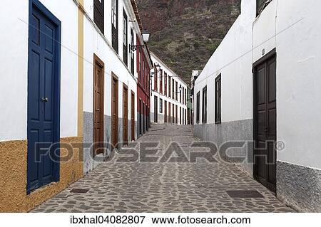 Street with typical houses in the old district of Las Casas, Agulo, La Gomera, Canary Islands, Spain, Europe View Large Photo Image Stock Photo - Street with typical houses in the old district of Las Casas, Agulo, La Gomera, Canary Islands, Spain, Europe. Fotosearch