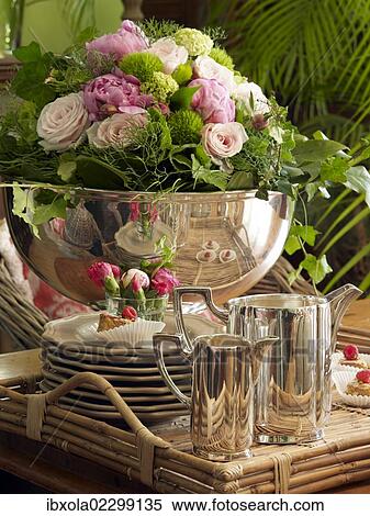 Stock Photography - Stylish silver coffee table accessories on a tray in a romantic setting. Fotosearch
