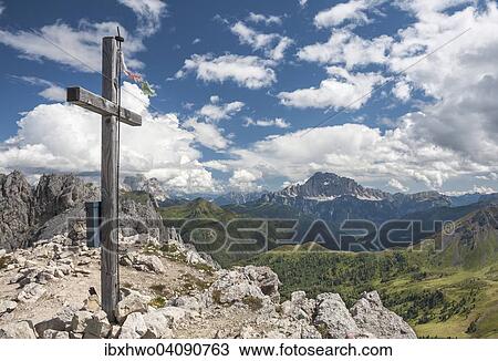 Stock Image - Summit cross of Mt Settsass, 2, 571 m, Monte Civetta, 3220 m, at the back, Cortina d'Ampezzo, Veneto, Dolomites, Italy, Europe. Fotosearch