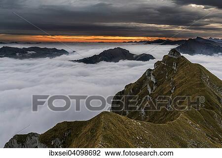 Summit of the Kanisfluh with cloud cover below, at sunrise, Au, Bregenz Forest, Vorarlberg, Austria, Europe View Large Photo Image Stock Image - Summit of the Kanisfluh with cloud cover below, at sunrise, Au, Bregenz Forest, Vorarlberg, Austria, Europe. Fotosearch
