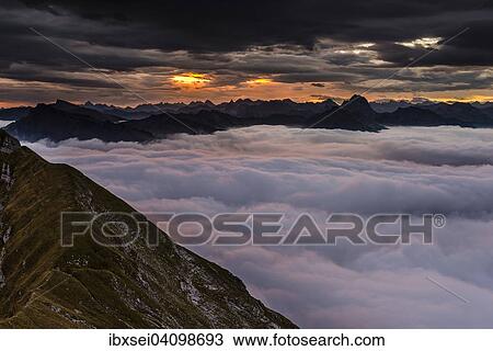 Summit of the Kanisfluh with cloud cover below, at sunrise, Au, Bregenz Forest, Vorarlberg, Austria, Europe View Large Photo Image Stock Image - Summit of the Kanisfluh with cloud cover below, at sunrise, Au, Bregenz Forest, Vorarlberg, Austria, Europe. Fotosearch