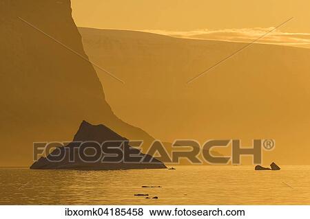 Sunrise, iceberg, Kejser Franz Joseph Fjord, Northeast Greenland National Park, Greenland, North America View Large Photo Image Stock Photo - Sunrise, iceberg, Kejser Franz Joseph Fjord, Northeast Greenland National Park, Greenland, North America. Fotosearch
