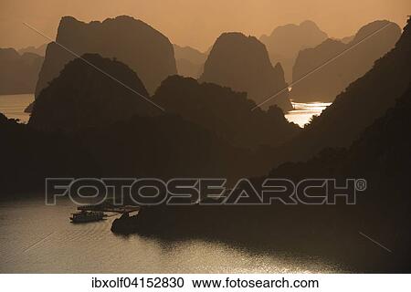 Sunset at Halong Bay or Vinh Ha Long, limestone cliffs, UNESCO World Heritage Site, Gulf of Tonkin, Halong, North Vietnam, Vietnam, Asia View Large Photo Image Stock Image - Sunset at Halong Bay or Vinh Ha Long, limestone cliffs, UNESCO World Heritage Site, Gulf of Tonkin, Halong, North Vietnam, Vietnam, Asia. Fotosearch