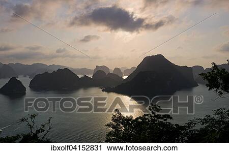 Sunset at Halong Bay or Vinh Ha Long, limestone cliffs, UNESCO World Heritage Site, Gulf of Tonkin, Halong, North Vietnam, Vietnam, Asia View Large Photo Image Stock Image - Sunset at Halong Bay or Vinh Ha Long, limestone cliffs, UNESCO World Heritage Site, Gulf of Tonkin, Halong, North Vietnam, Vietnam, Asia. Fotosearch