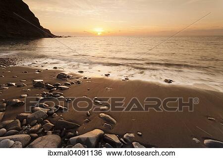 Stock Photograph - Sunset at Playa de Alojera beach, Alojera, La Gomera, Canary Islands, Spain, Europe. Fotosearch