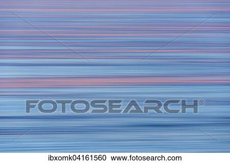 Stock Image - Sunset glow, sea, Denmark Strait, Greenland, North America. Fotosearch