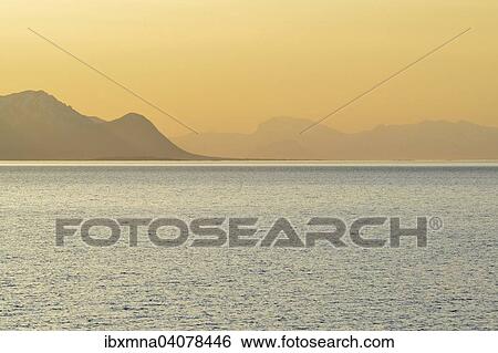 Sunset in the fjord with mountains in the mist, Hadselfjord, Nordland, Vesteralen, Lofoten, Norway, Europe View Large Photo Image Stock Photograph - Sunset in the fjord with mountains in the mist, Hadselfjord, Nordland, Vesteralen, Lofoten, Norway, Europe. Fotosearch