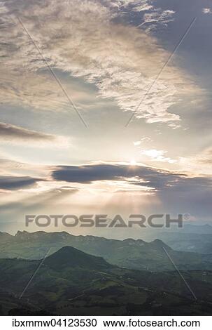 Stock Image - Sunset with dramatic clouds, San Marino, Europe. Fotosearch