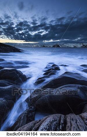 Surf on rocky coast, Henningsvaer, Austvagoya, Lofoten, Norway, Europe View Large Photo Image Picture - Surf on rocky coast, Henningsvaer, Austvagoya, Lofoten, Norway, Europe. Fotosearch