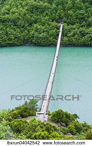 Stock Image - Suspension bridge across the Black Drin River, Albania, Europe. Fotosearch