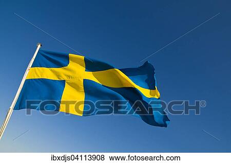 Stock Photo - Swedish flag blowing in the wind. Fotosearch