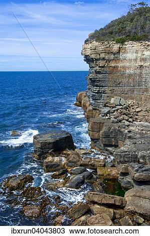 Stock Image - Tasman Arch and Devil's Kitchen, Tasman Peninsula, Tasmania, Australia, Oceania. Fotosearch