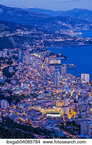 The coastline with the city at dusk, Monaco, Europe View Large Photo Image Picture - The coastline with the city at dusk, Monaco, Europe. Fotosearch