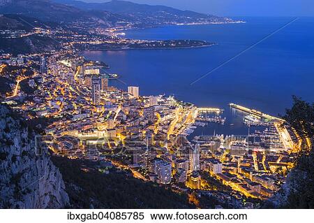 Stock Photography - The coastline with the city at dusk, Monaco, Europe. Fotosearch