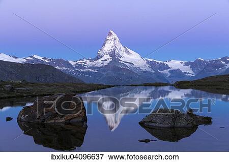 Stock Photo - The Matterhorn reflected in Stellisee lake, morning atmosphere, Zermatt, Canton of Valais, Switzerland, Europe. Fotosearch