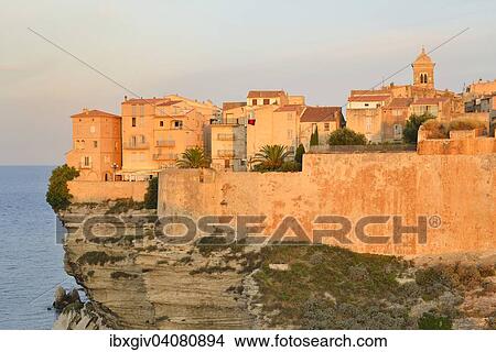 The medieval old town on the limestone cliff in the morning light, Bonifacio, Corse-du-Sud, Corsica, France, Europe View Large Photo Image Picture - The medieval old town on the limestone cliff in the morning light, Bonifacio, Corse-du-Sud, Corsica, France, Europe. Fotosearch