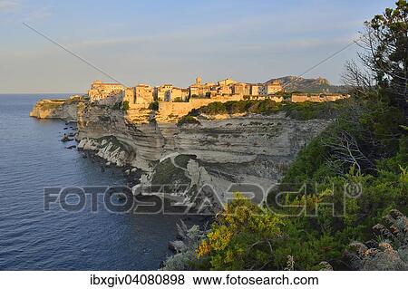 The medieval old town on the limestone cliff in the morning light, Bonifacio, Corse-du-Sud, Corsica, France, Europe View Large Photo Image Stock Photo - The medieval old town on the limestone cliff in the morning light, Bonifacio, Corse-du-Sud, Corsica, France, Europe. Fotosearch