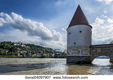 The medieval Schaiblingsturm tower, flooded promenade of the Inn river during high water, Innkai waterfront, historic centre, at the top the pilgrimage church of Mariahilf Monastery, Passau, Lower Bavaria, Bavaria, Germany, Europe View Large Photo Image Stock Photo - The medieval Schaiblingsturm tower, flooded promenade of the Inn river during high water, Innkai waterfront, historic centre, at the top the pilgrimage church of Mariahilf Monastery, Passau, Lower Bavaria, Bavaria, Germany, Europe. Fotosearch