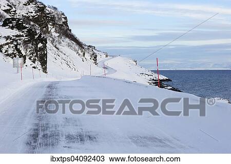 The snow-covered main road E69 on Porsangerfjord, Finnmark County, Norway, Europe View Large Photo Image Stock Image - The snow-covered main road E69 on Porsangerfjord, Finnmark County, Norway, Europe. Fotosearch