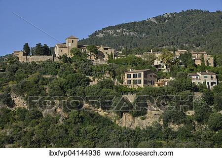 The village of Deia, Serra de Tramuntana, Majorca, Balearic Islands, Spain, Europe View Large Photo Image Stock Photograph - The village of Deia, Serra de Tramuntana, Majorca, Balearic Islands, Spain, Europe. Fotosearch