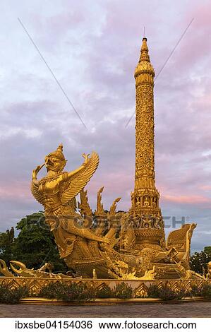 Thung Si Muang Park, Mueang, Garuda figure in front of the Golden Giant Candle, Candle Monument, Ubon Ratchathani, Isan, Isaan, Thailand, Asia View Large Photo Image Stock Photograph - Thung Si Muang Park, Mueang, Garuda figure in front of the Golden Giant Candle, Candle Monument, Ubon Ratchathani, Isan, Isaan, Thailand, Asia. Fotosearch