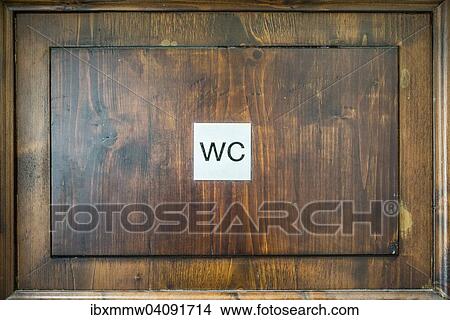 Picture - Toilet sign on a wooden door. Fotosearch