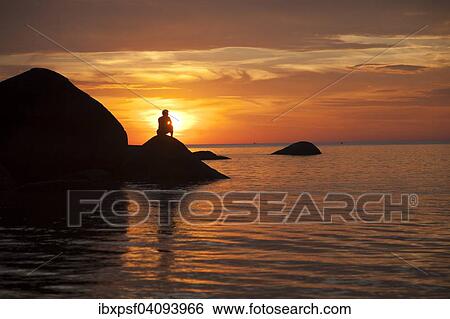 Tourist watching the sunset on Palolem Beach, Goa, India, Asia View Large Photo Image Stock Photograph - Tourist watching the sunset on Palolem Beach, Goa, India, Asia. Fotosearch