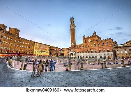 Stock Photo - Tourists at the Palazzo Pubblico with Mangia Tower and Chapel, Piazza Il Campo, Siena, Tuscany, Italy, Europe. Fotosearch