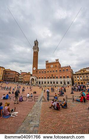 Stock Photograph - Tourists at the Palazzo Pubblico with Mangia Tower and Chapel, Piazza Il Campo, Siena, Tuscany, Italy, Europe. Fotosearch