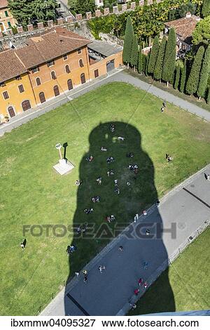 Stock Photo - Tourists cooling off in the shade of the Leaning Tower of Pisa, Piazza del Duomo, Piazza dei Miracoli, Pisa, Tuscany, Italy, Europe. Fotosearch