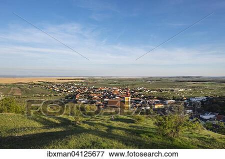 Stock Photo - Town View with Mountain Church of St. Martin and Lake Neusiedl, Donnerskirchen, Northern Burgenland, Burgenland, Austria, Europe. Fotosearch