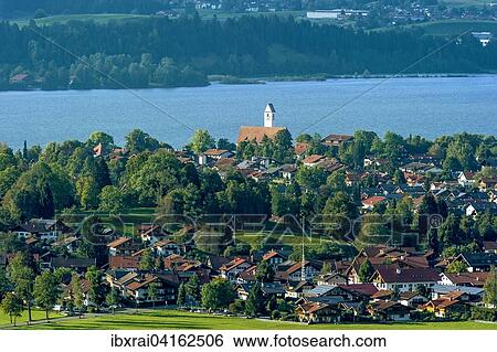 Stock Photograph - Townscape, lake Forggensee, Schwangau, Konigswinkel, Ostallgau, Allgau, Swabia, Bavaria, Germany, Europe. Fotosearch