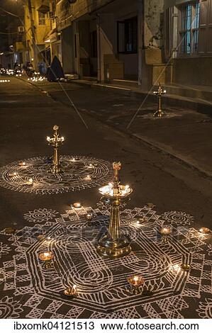 Traditional Rangoli, Kolam or Muggu, decorative pattern, and oil lamps in front of a house entrance, Tamil quarter, Kochi, Kerala, India, Asia View Large Photo Image Stock Image - Traditional Rangoli, Kolam or Muggu, decorative pattern, and oil lamps in front of a house entrance, Tamil quarter, Kochi, Kerala, India, Asia. Fotosearch