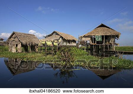 Traditional stilt houses in Inle Lake, reflection in the water, Shan State, Myanmar, Asia View Large Photo Image Stock Image - Traditional stilt houses in Inle Lake, reflection in the water, Shan State, Myanmar, Asia. Fotosearch