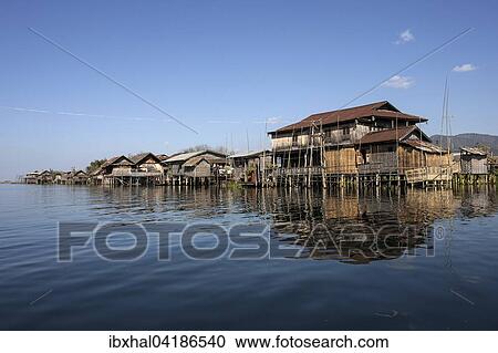 Traditional stilt houses in Inle Lake, reflection in the water, Shan State, Myanmar, Asia View Large Photo Image Stock Image - Traditional stilt houses in Inle Lake, reflection in the water, Shan State, Myanmar, Asia. Fotosearch