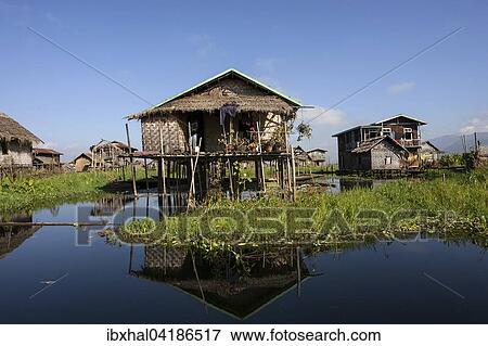 Traditional stilt houses in Inle Lake, reflection in the water, Shan State, Myanmar, Asia View Large Photo Image Stock Photo - Traditional stilt houses in Inle Lake, reflection in the water, Shan State, Myanmar, Asia. Fotosearch