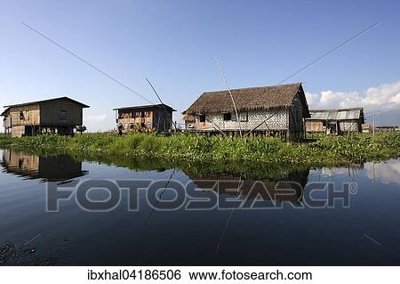 Traditional stilt houses in Inle Lake with reflection in the water, Shan State, Myanmar, Asia View Large Photo Image Stock Photograph - Traditional stilt houses in Inle Lake with reflection in the water, Shan State, Myanmar, Asia. Fotosearch