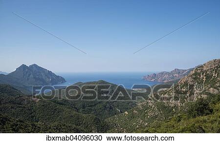 Stock Image - Two headlands on the west coast of Corsica, Gulf of Porto, Corsica, France, Europe. Fotosearch